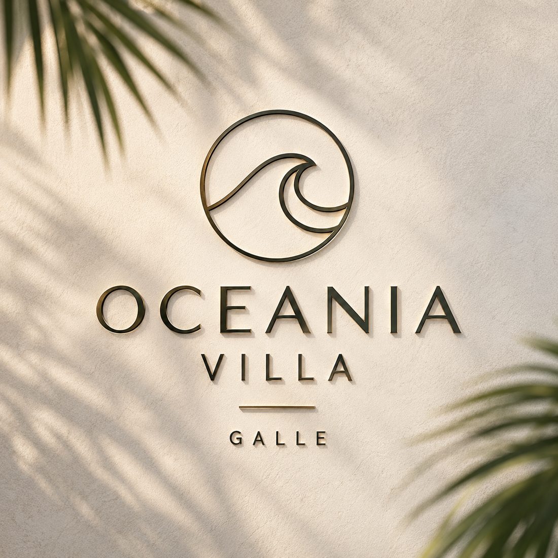 The Oceania Villa brass sign on a cream wall with palm shadows